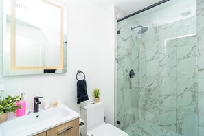 Shower, hair dryer, towels, soap