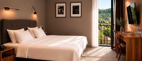 Deluxe Double Room, Multiple Bedrooms, Balcony, Hill View | In-room safe, desk, laptop workspace, iron/ironing board