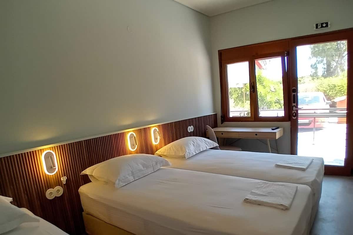 Comfort Triple Room, Garden View | In-room safe, blackout drapes, soundproofing, iron/ironing board