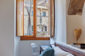 Luxury Triple Room, City View | Desk, laptop workspace, free WiFi