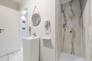 Luxury Triple Room, City View | Bathroom | Shower, hair dryer, bathrobes, towels