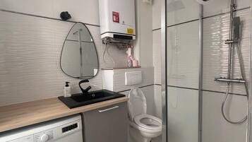 Shower, towels, soap, toilet paper