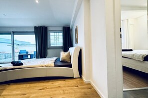 2 habitaciones, tabla de planchar con plancha y ropa de cama 
