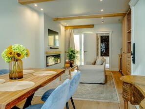 Suite, City View | Living area | 65-inch Smart TV with cable channels, fireplace - The Lovelace Residence (Bruges)