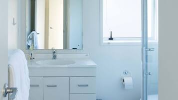 Shower, hair dryer, towels, soap