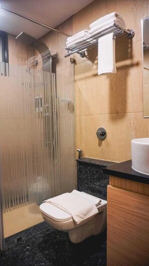 Business Single Room | Bathroom | Slippers - Santrina Hotels (Bengaluru)
