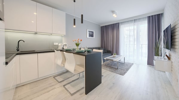Apartment (27A) | Private kitchen | Fridge, stovetop, electric kettle, cookware/dishes/utensils