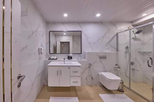 Shower, free toiletries, hair dryer, slippers