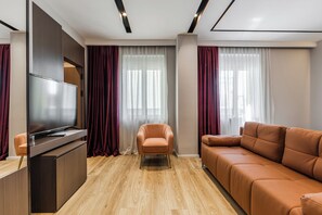 Chambre Deluxe | Coffre-fort, rideaux d’obscurcissement, fer et planche à repasser