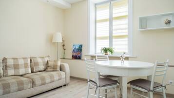 Deluxe Apartment, City View | Living area | 42-inch LCD TV with cable channels