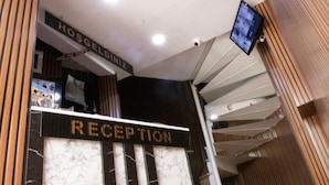 A reception area with a sign that reads "RECEPTION" and "HOSGELODINZ". - mesil hotel  (Istanbul)