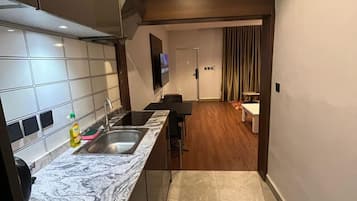 Suíte, para não fumantes | Cozinha americana privada | Frigobar, cooktop