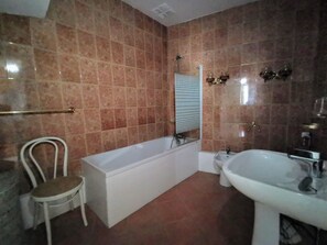 Bidet, towels, toilet paper