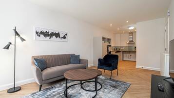 Standard Apartment (2 Bedrooms) | Living area | 32-inch flat-screen TV with digital channels