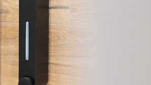 A modern, minimalist door handle on a wooden floor. - Modern Room Exarchia Room 4 (Αθήνα)