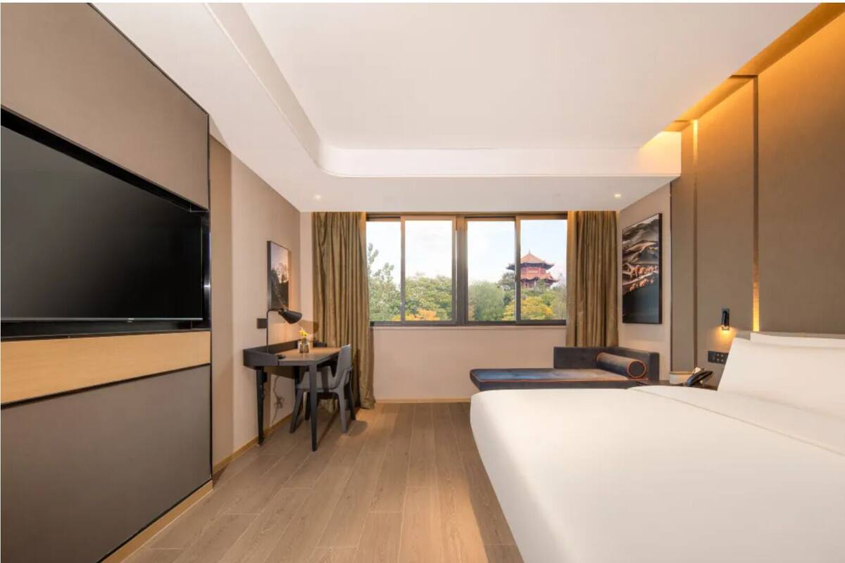 Chambre Deluxe, 1 trÚs grand lit, cÎté jardin