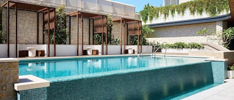 Outdoor pool, open 7:00 AM to 8:00 PM, pool umbrellas, pool loungers