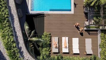 Outdoor pool, open 7:00 AM to 8:00 PM, pool umbrellas, pool loungers