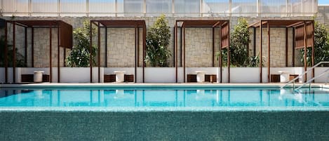 Outdoor pool, open 7:00 AM to 8:00 PM, pool umbrellas, pool loungers