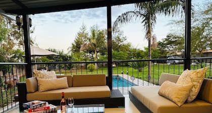 Charming 2-bedroom house in peaceful Harare with a Pool ,AC, WiFi & fitness room