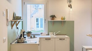 Fridge, stovetop, coffee/tea maker, cookware/dishes/utensils