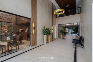 A modern interior with a café, seating area, and a staircase. - Your Perfect Stay in Urubici Starts Here! CZZ (Urubici)