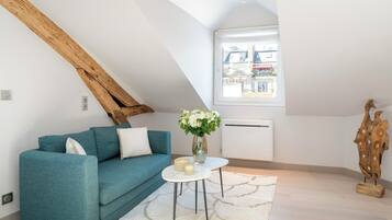 Deluxe Apartment, Courtyard View | Living area | 80-cm Smart TV with digital channels