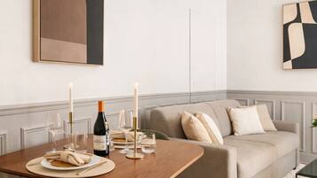 Deluxe Apartment, Courtyard View | Living area | 80-cm Smart TV with digital channels