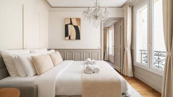Deluxe Apartment, Courtyard View | Living area | 80-cm Smart TV with digital channels