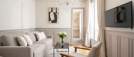 Deluxe Apartment, Courtyard View | Living area | 80-cm Smart TV with digital channels