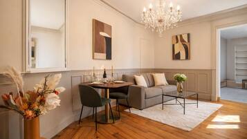 Deluxe Apartment, Courtyard View | Living area | 80-cm Smart TV with digital channels