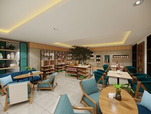 Un intérieur moderne comprenant un coin salon, des étagères et une plante d’ornement placée au centre.