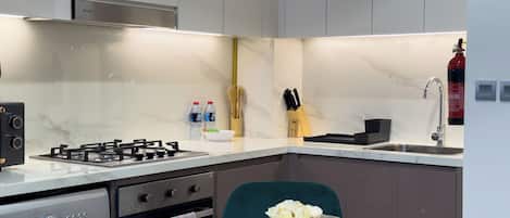 Fridge, microwave, toaster, cookware/dishes/utensils