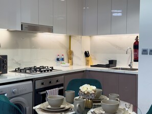 Fridge, microwave, toaster, cookware/dishes/utensils