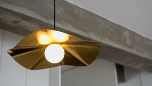 A pendant light with a unique, metallic design. - GuestReady – A welcoming space to unwind (Porto)