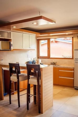 Fridge, microwave, cookware/dishes/utensils