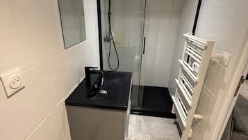 Shower, towels, soap, toilet paper