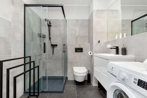 Shower, hair dryer, towels, shampoo