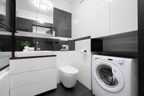 Shower, hair dryer, towels, shampoo