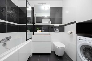 Shower, hair dryer, towels, shampoo