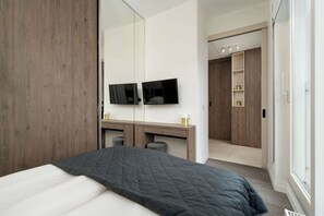 1 bedroom, desk, iron/ironing board, travel crib