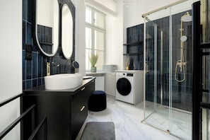 Shower, hair dryer, towels, shampoo
