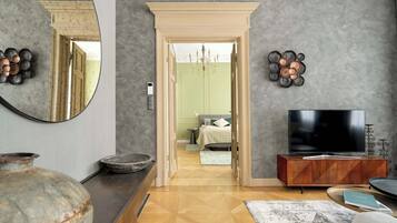 1 bedroom, desk, iron/ironing board, travel crib