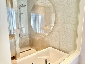 Shower, hair dryer, towels, soap