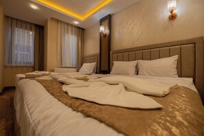 Ropa de cama de alta calidad, edredón, camas Select Comfort y minibar 