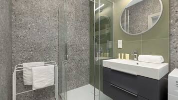 Shower, hair dryer, towels, shampoo