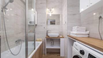 Shower, hair dryer, towels, shampoo