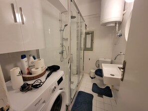 Hair dryer, towels, soap, shampoo
