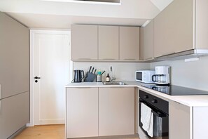 Fridge, microwave, coffee/tea maker, toaster