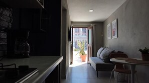 Standard Apartment | Living area | 24-inch flat-screen TV with cable channels